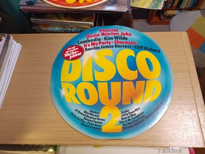 LP Disco Round 2 Physical - Olivia Newton John - Cmbodia - Kim Wilde ad. (627424) GD6